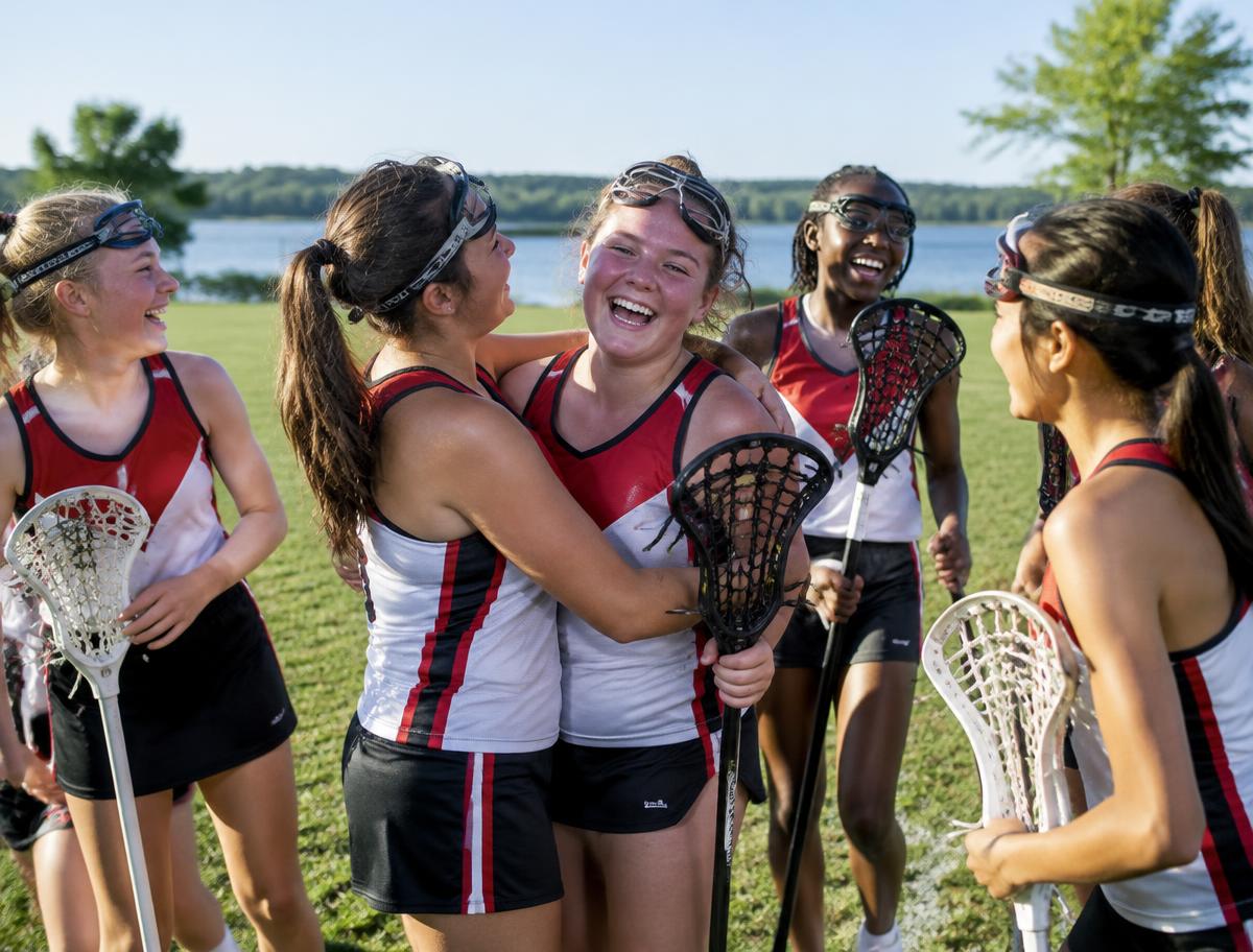 Girls lacrosse players celebrating together